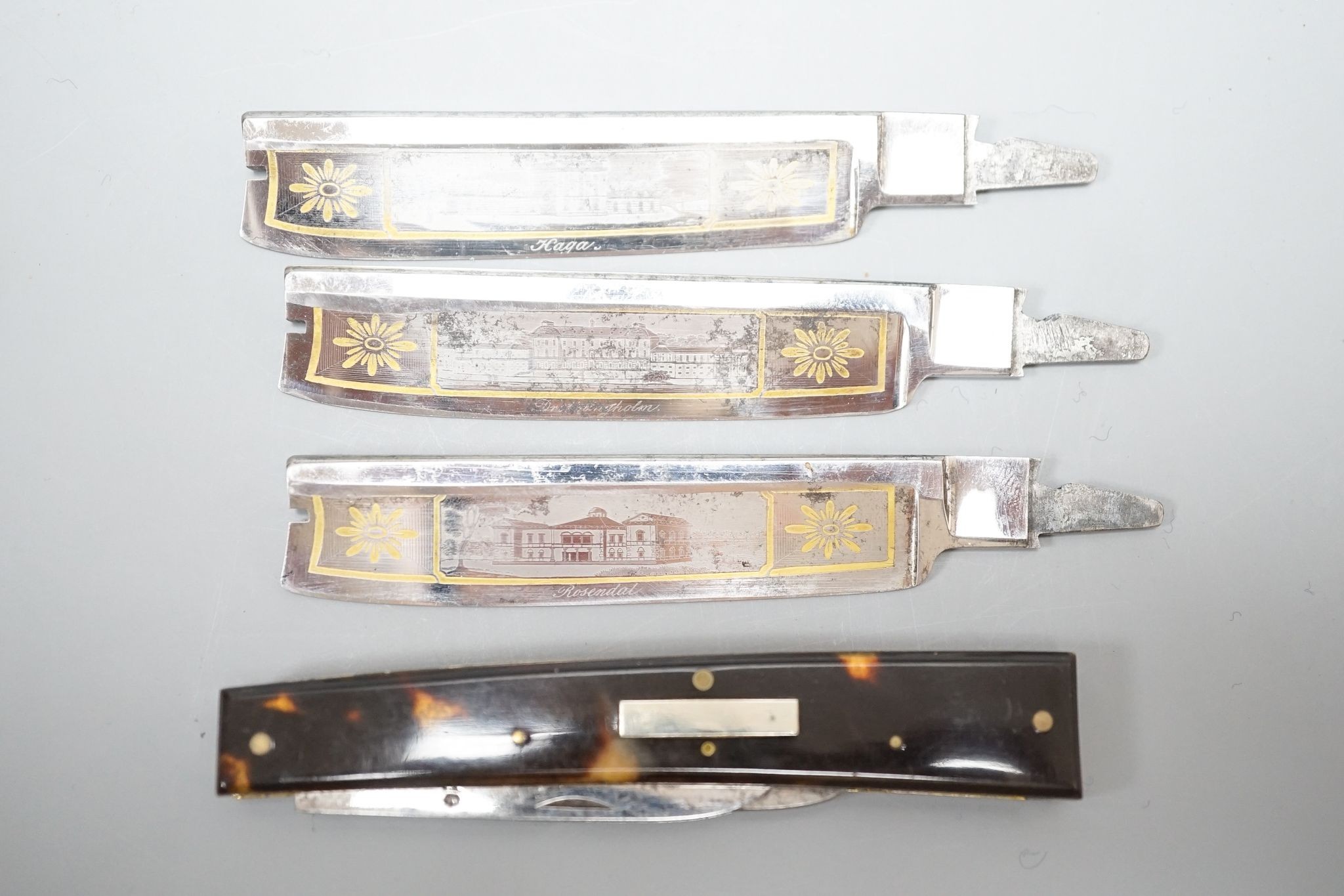 A 19th century Ostenberg morocco leather cased set of three cut throat razors with topographical etched blades, case 10.5cm